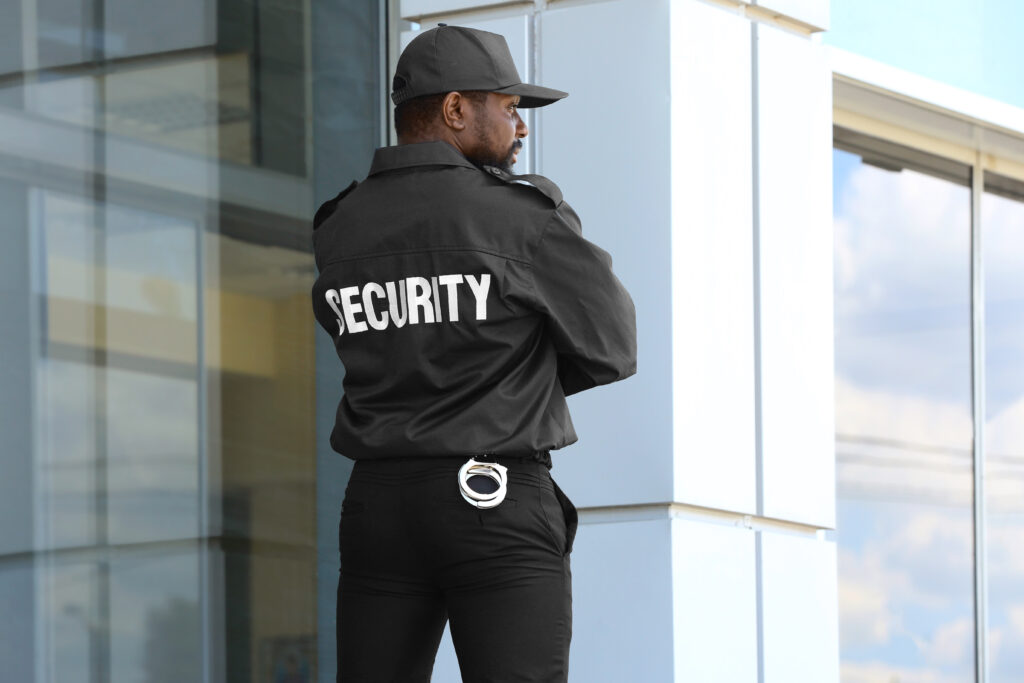 security guard guarding building during the day